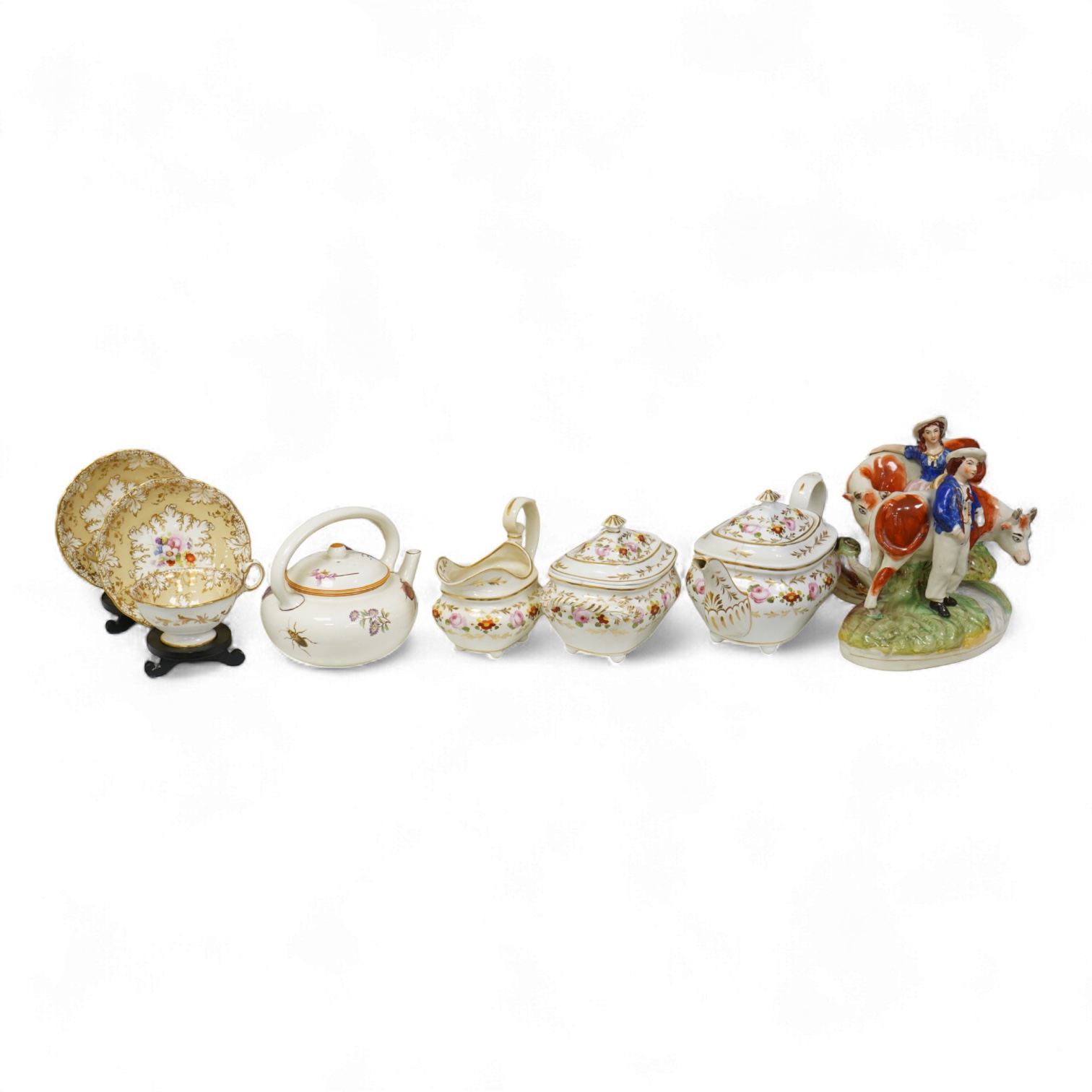 An early 19th century Derby three piece tea service, A pair of Staffordshire cow groups, Wedgwood etc